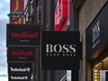 Advertising sign above shop of German clothing brand Hugo Boss in shopping street KÃÂ¶nigstraÃÅ¸e. Royalty Free Stock Photo